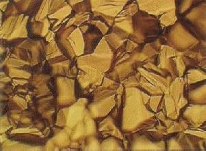 Iron sulfide crystals growing on iron metal (top view).